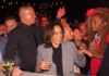 Kamala Harris smiling in a crowd at an event.