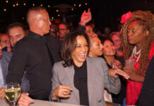 Kamala Harris smiling in a crowd at an event.