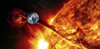 Earth near erupting sun with solar flare visible.