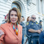 BANNED Politician Gets Catholic University’s Highest Honor… Nancy Pelosi speaking outside a government building.