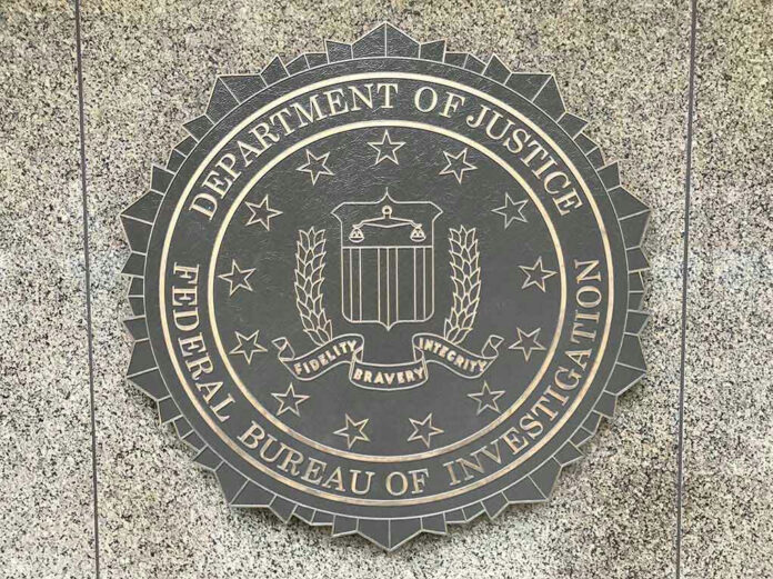 772723264 Department of Justice, FBI seal on stone background.
