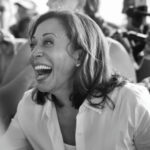 DNC HIDES Explosive 2024 Election Autopsy… A smiling woman in a crowd, black and white.