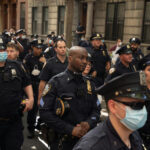 Police officers gathered on a city street