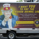 Truck billboard showing a message criticizing Anthony Fauci.