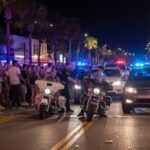 Terrifying VIDEO: Flamethrower UNLEASED in Virginia! Police officers managing a crowd on a busy street at night