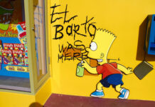 Simpsons Writer’s WILD 2028 Run: Real or Satire? Graffiti of Bart Simpson writing El Barto was here on a yellow wall