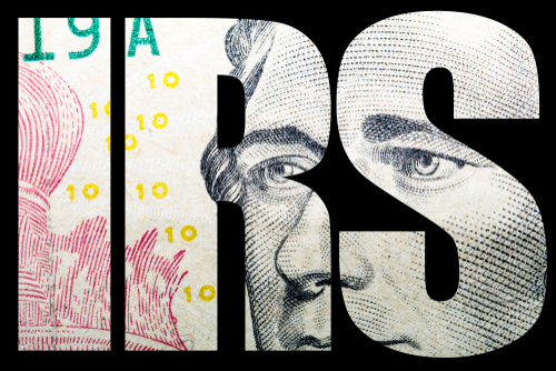 Close-up of a banknote featuring the letters IRS