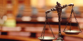Bronze balance scale in courtroom.