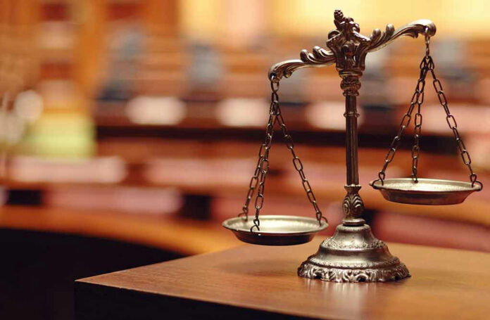 140867215 Bronze balance scale in courtroom.
