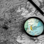 $14B Standoff: Taiwan Left Hanging Map of China, Taiwan magnified, surrounded by pins, compass.