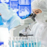 Gabbard Drops Files — 120+ Biolabs Abroad Revealed Scientists examining samples under microscopes in a laboratory.