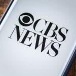 CBS Shakeup: Pelley Out, Fallout Just Beginning Phone screen showing CBS News logo.