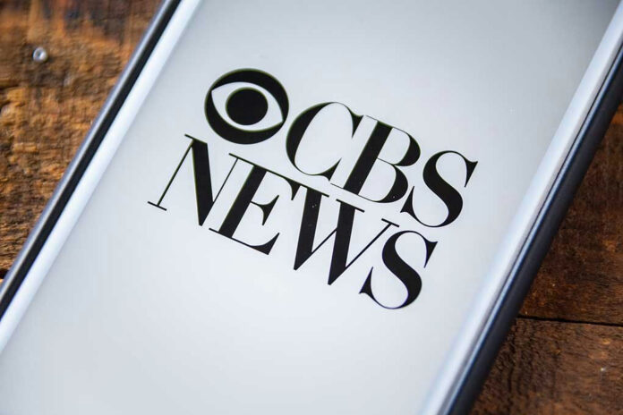 487851835 Phone screen showing CBS News logo.
