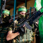 Gaza Charity Scam Exposed — DOJ Pounces Two armed masked soldiers with green flags.