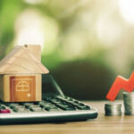 NYC’s ‘Rich Tax’ Targets The Wrong Homes Toy house, calculator, coins, and red upward arrow.