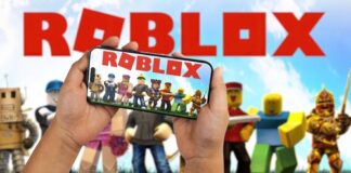 Hands holding a smartphone displaying the Roblox game with characters in the background