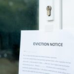 Squatter Crisis Sparks DIY Enforcer An eviction notice posted on a door with a keyhole visible