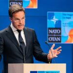 Quiet U.S. Pullback Rattles NATO NATO flags displayed at the headquarters under a clear blue sky