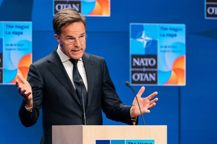 Den,Haag,,Netherlands,-,June,23,2025:,Nato,Secretary,General NATO flags displayed at the headquarters under a clear blue sky