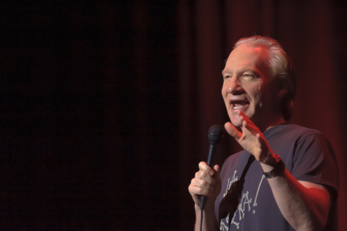 Sacramento,,Ca,-,Aug,19:,Bill,Maher,Performs,At,Sacramento A comedian performing on stage with a microphone in hand