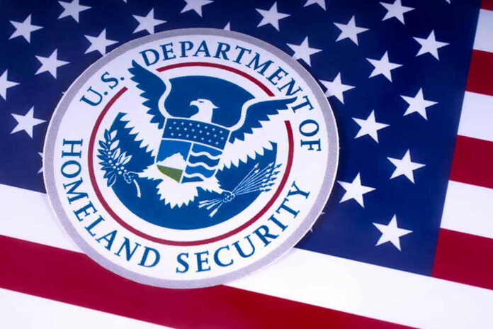 1051372526 US Homeland Security emblem over American flag