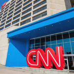 Buried Texts Scramble CNN’s Platner Story CNN headquarters building with large logo outside.