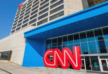 Buried Texts Scramble CNN’s Platner Story CNN headquarters building with large logo outside.
