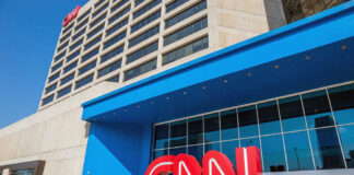 CNN headquarters building with large logo outside.