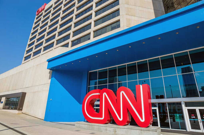 CNN headquarters building with large logo outside.