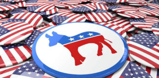 Democratic donkey symbol button among American flag buttons.