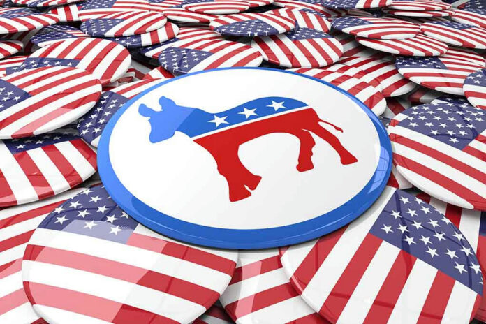 402776938 Democratic donkey symbol button among American flag buttons.