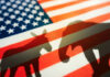 Shadows of a donkey and elephant on an American flag