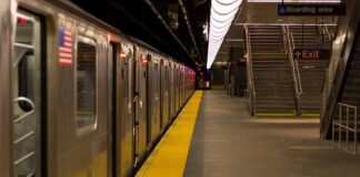 Subway train at an empty underground platform