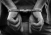Doorstep Deception Turns Violent—Brooklyn Shaken hands in handcuffs behind back