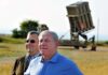 Federal Supremacy Smacks Down NYC Stunt two men standing near a missile defense launcher outdoors