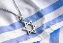 Star of David pendant on blue and white cloth